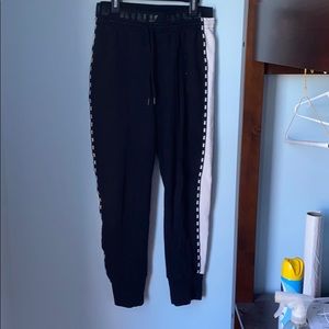 pink brand black sweatpants with white side stripe